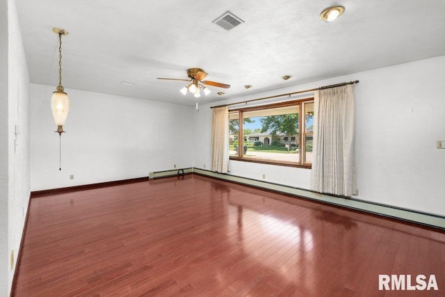 22 Pleasant View Dr, Annawan, IL 61234 - unfurnished room with ceiling fan, a baseboard heating unit, and wood finished floors