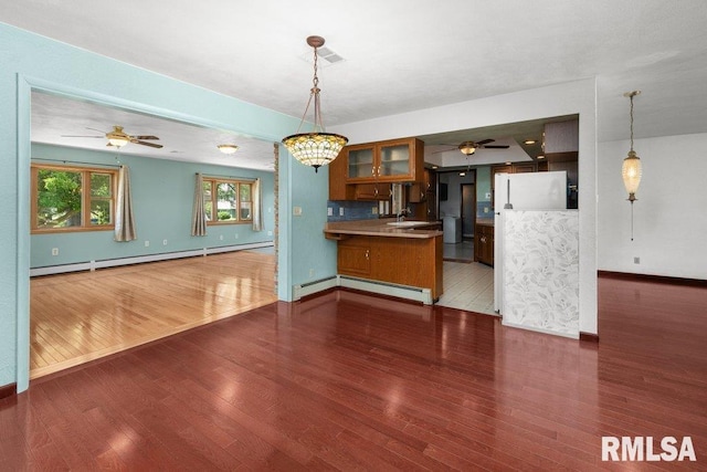 22 Pleasant View Dr, Annawan, IL 61234 - kitchen featuring a baseboard radiator, refrigerator, and ceiling fan