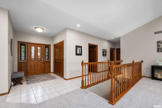12828 25th Street Ct, Milan, IL 61264 - entrance foyer with recessed lighting, light colored carpet, and light tile patterned flooring