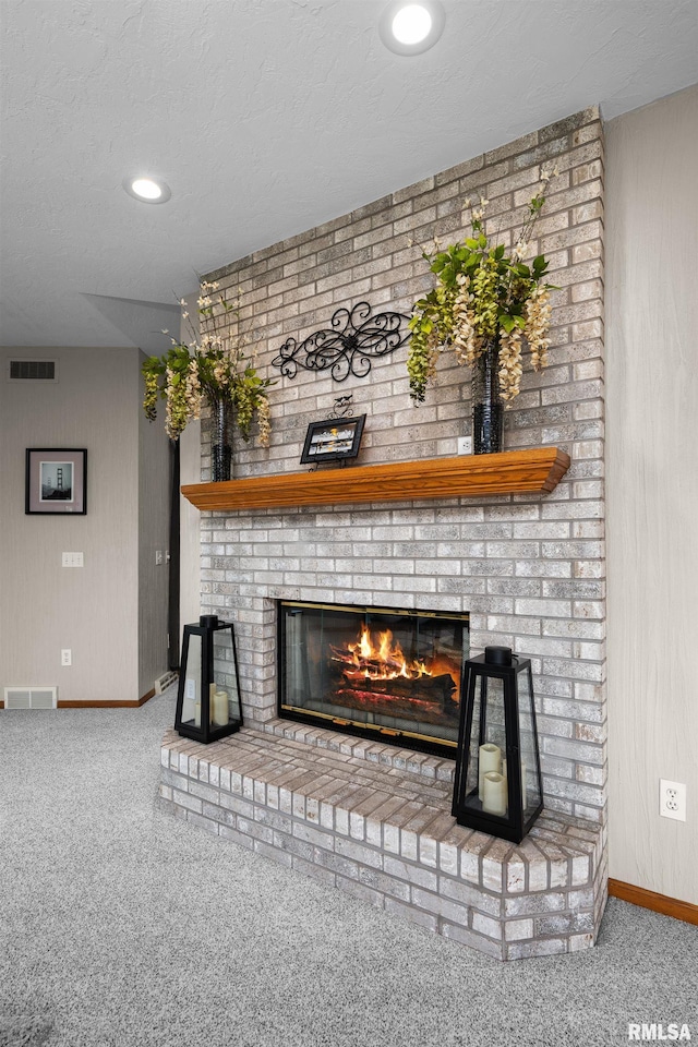 12828 25th Street Ct, Milan, IL 61264 - detailed view of carpet flooring, a brick fireplace, and recessed lighting