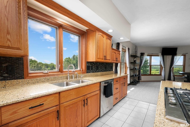 12828 25th Street Ct, Milan, IL 61264 - kitchen with stainless steel appliances, light carpet, backsplash, light tile patterned floors, and light stone countertops