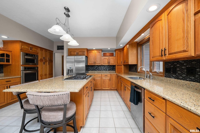 12828 25th Street Ct, Milan, IL 61264 - kitchen with appliances with stainless steel finishes, light tile patterned floors, light stone countertops, a breakfast bar area, and decorative backsplash