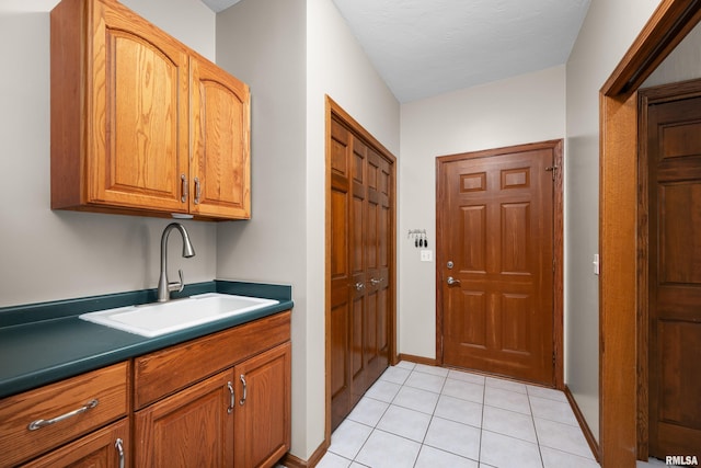 12828 25th Street Ct, Milan, IL 61264 - laundry area with a sink and light tile patterned floors