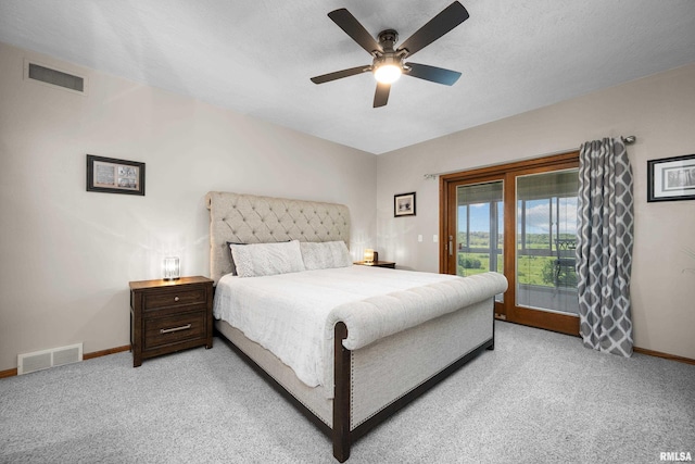 12828 25th Street Ct, Milan, IL 61264 - bedroom with light carpet, access to exterior, and a ceiling fan