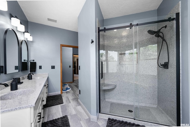 12828 25th Street Ct, Milan, IL 61264 - full bathroom featuring double vanity and a stall shower