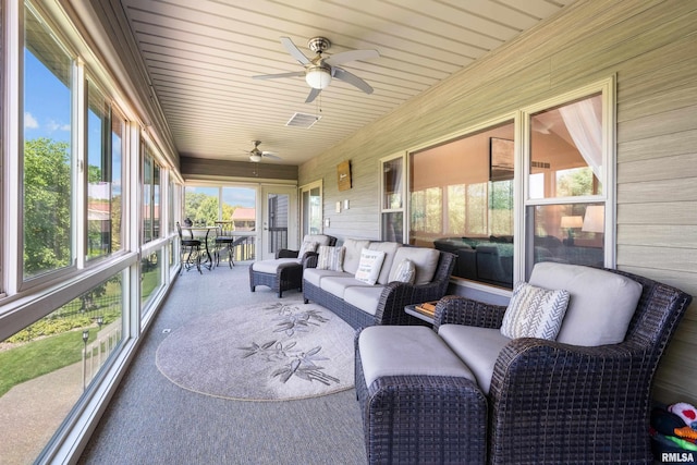 12828 25th Street Ct, Milan, IL 61264 - sunroom featuring a ceiling fan and outdoor lounge area