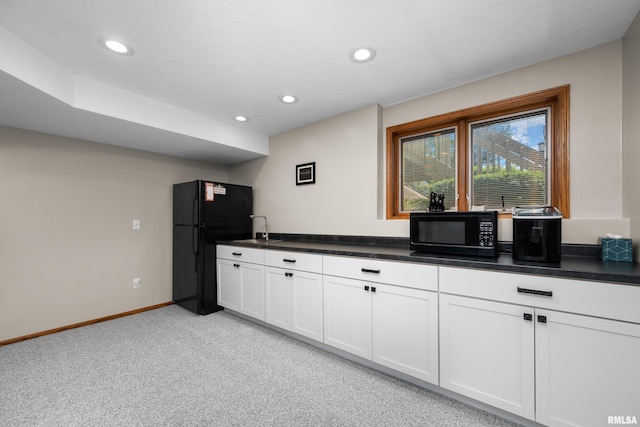12828 25th Street Ct, Milan, IL 61264 - kitchen featuring black appliances, light carpet, dark countertops, white cabinets, and recessed lighting