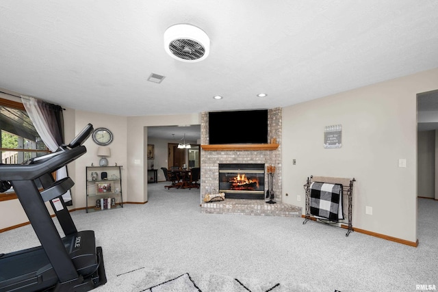 12828 25th Street Ct, Milan, IL 61264 - workout room featuring carpet floors and a brick fireplace