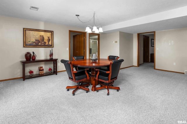 12828 25th Street Ct, Milan, IL 61264 - carpeted dining space featuring baseboards and a chandelier