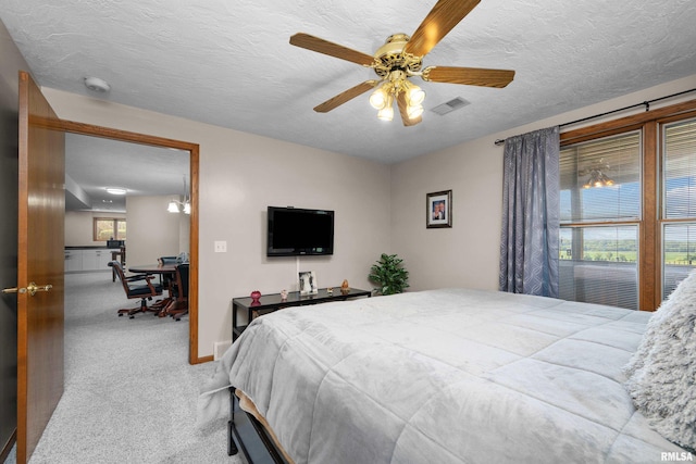 12828 25th Street Ct, Milan, IL 61264 - bedroom with carpet, a textured ceiling, ceiling fan, and an office area