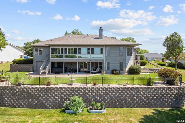 12828 25th Street Ct, Milan, IL 61264 - back of property featuring stairway, a chimney, a patio area, and a fenced backyard