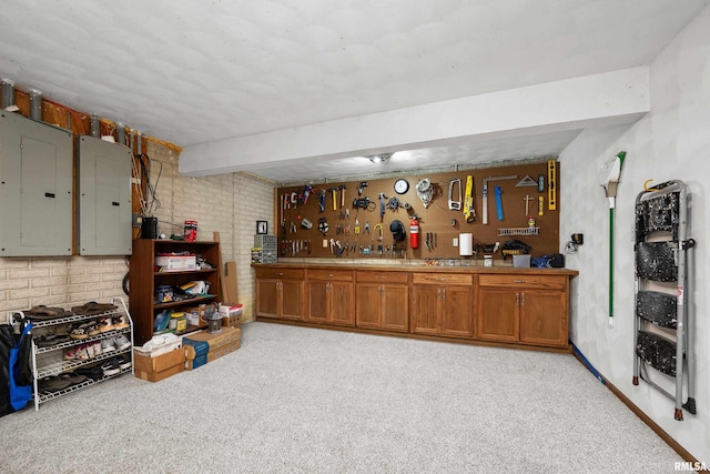 12828 25th Street Ct, Milan, IL 61264 - bar area featuring electric panel, light carpet, a workshop area, and brick wall