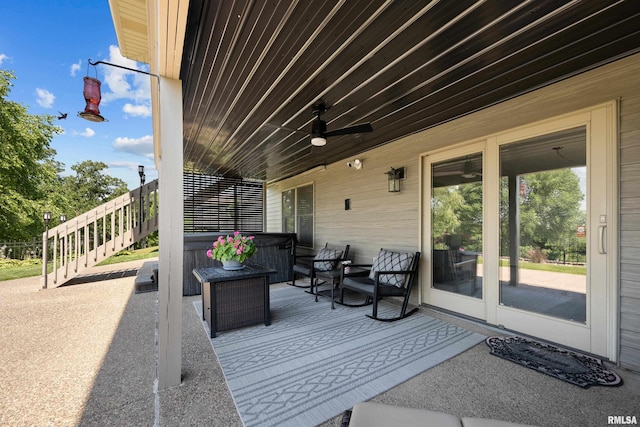 12828 25th Street Ct, Milan, IL 61264 - wooden deck with a hot tub, ceiling fan, and a patio