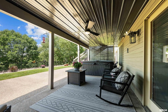 12828 25th Street Ct, Milan, IL 61264 - wooden terrace featuring a hot tub, ceiling fan, a patio, and view of scattered trees