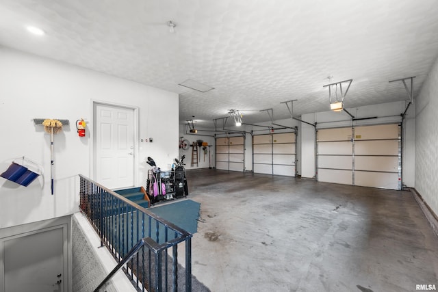 12828 25th Street Ct, Milan, IL 61264 - garage with a garage door opener