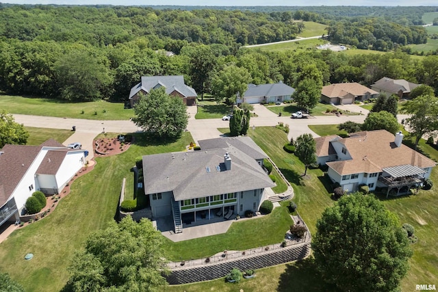 12828 25th Street Ct, Milan, IL 61264 - aerial view of residential area featuring a heavily wooded area