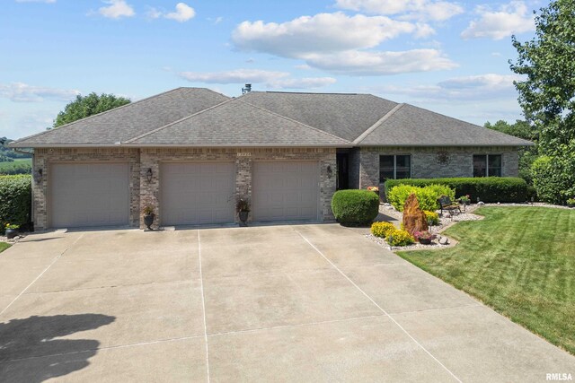 12828 25th Street Ct, Milan, IL 61264 - view of front of property featuring an attached garage, driveway, a front lawn, and a shingled roof