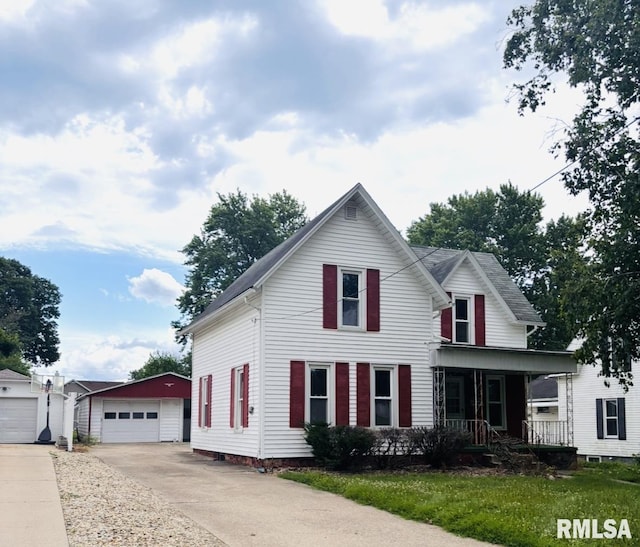 324 S Cottage St, Kewanee, IL 61443 - traditional-style home featuring covered porch, an outbuilding, and a detached garage
