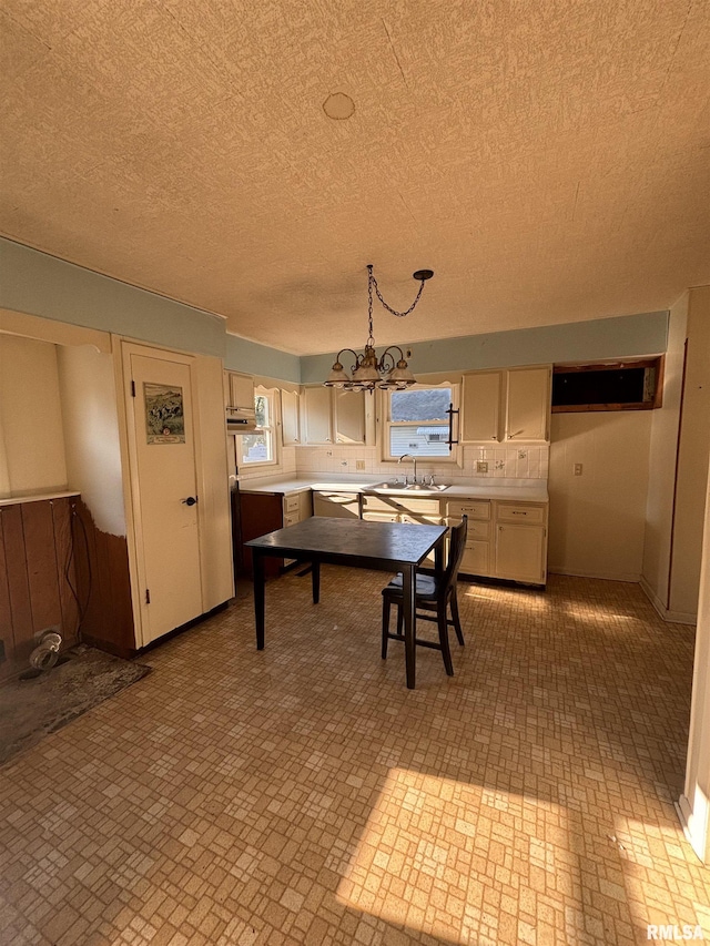 324 S Cottage St, Kewanee, IL 61443 - kitchen featuring light countertops, a chandelier, and a textured ceiling