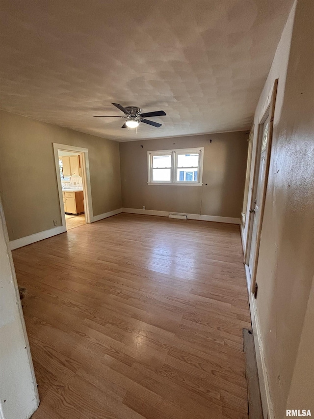 324 S Cottage St, Kewanee, IL 61443 - unfurnished room featuring light wood-style floors and ceiling fan