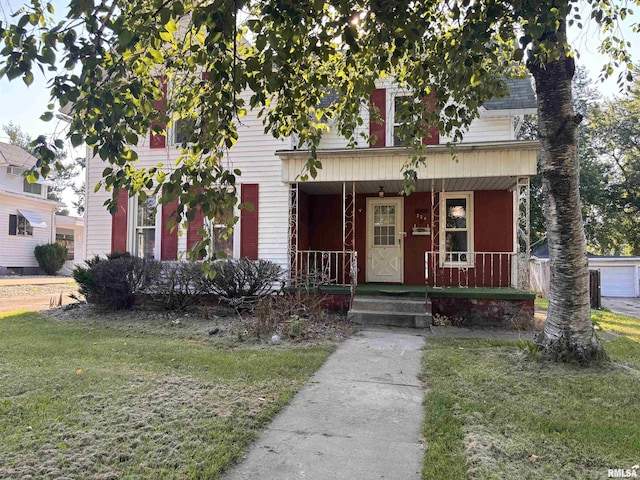 324 S Cottage St, Kewanee, IL 61443 - view of front facade featuring a porch and a front lawn