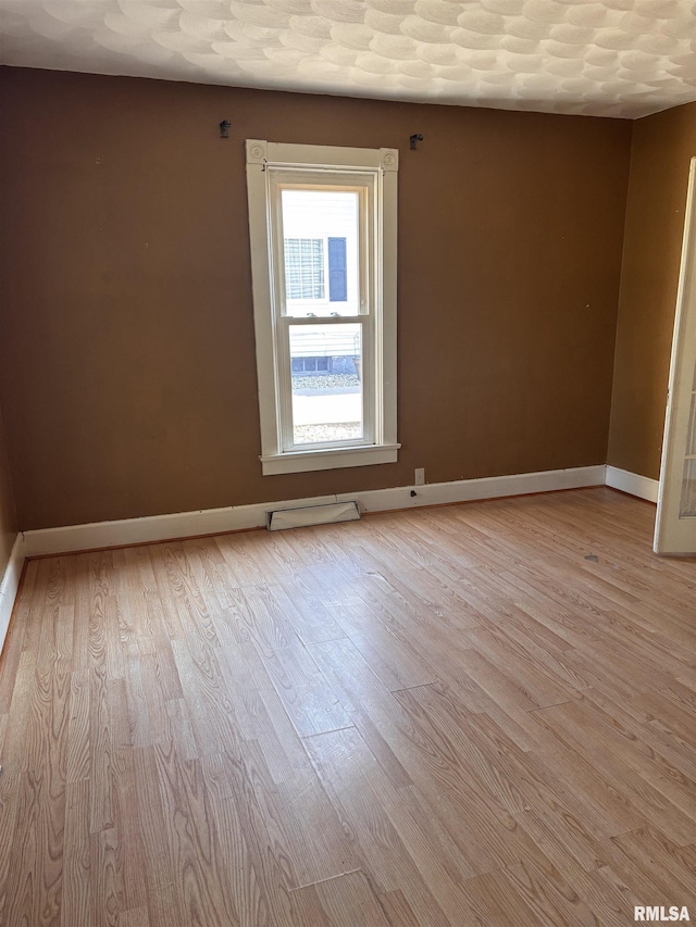 324 S Cottage St, Kewanee, IL 61443 - empty room with light wood-style floors and baseboards