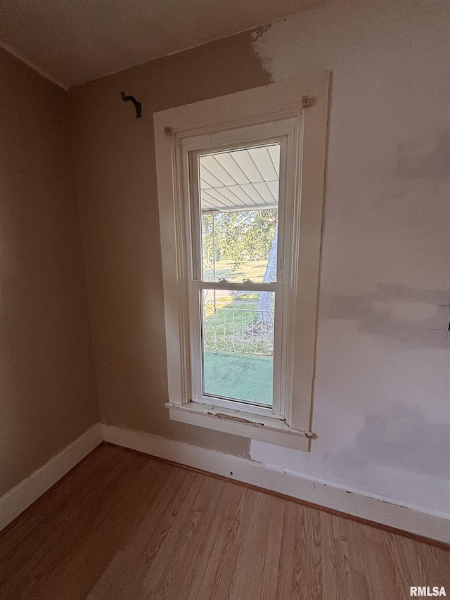 324 S Cottage St, Kewanee, IL 61443 - unfurnished room featuring wood finished floors and baseboards
