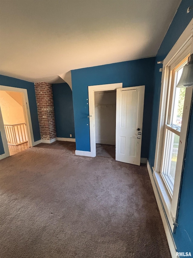 324 S Cottage St, Kewanee, IL 61443 - unfurnished bedroom featuring carpet flooring, multiple windows, and a closet