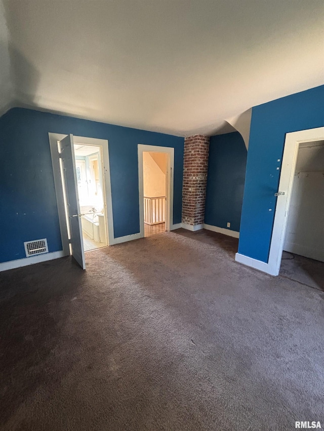324 S Cottage St, Kewanee, IL 61443 - carpeted empty room featuring vaulted ceiling and baseboards