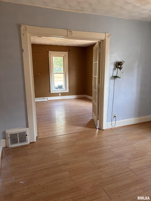324 S Cottage St, Kewanee, IL 61443 - spare room with wood finished floors and baseboards