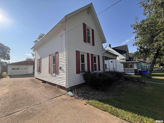324 S Cottage St, Kewanee, IL 61443 - view of property exterior with an outbuilding and a detached garage