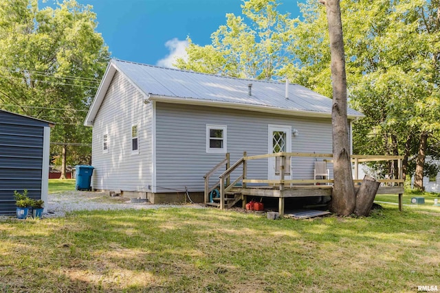 504 E Vermont St, Carterville, IL 62918 - rear view of house featuring a wooden deck, a lawn, and a metal roof