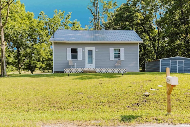 504 E Vermont St, Carterville, IL 62918 - bungalow-style house featuring a front lawn and a metal roof
