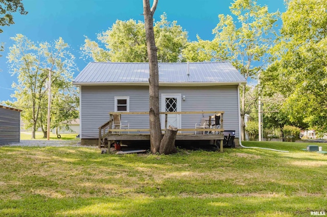 504 E Vermont St, Carterville, IL 62918 - back of property with a wooden deck, a lawn, and a metal roof