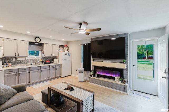 504 E Vermont St, Carterville, IL 62918 - living area with light wood-style floors, ceiling fan, a glass covered fireplace, and recessed lighting