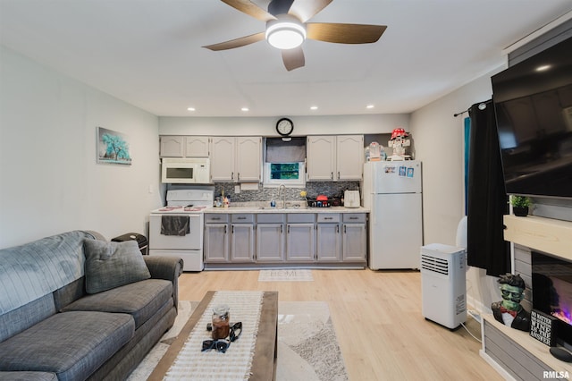 504 E Vermont St, Carterville, IL 62918 - living area featuring light wood-type flooring, a ceiling fan, and recessed lighting