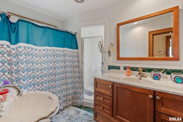 2016 12th St, Rock Island, IL 61201 - full bath with tile walls, curtained shower, tile patterned flooring, and vanity