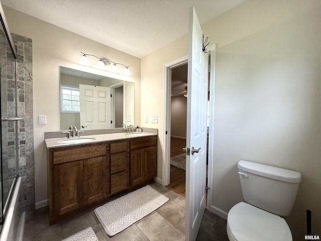312 Mcvicker Dr, Energy, IL 62933 - bathroom featuring double vanity, tile patterned floors, a ceiling fan, and a shower