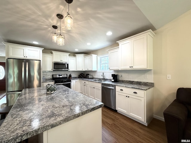 312 Mcvicker Dr, Energy, IL 62933 - kitchen featuring appliances with stainless steel finishes, dark wood finished floors, white cabinetry, recessed lighting, and decorative backsplash