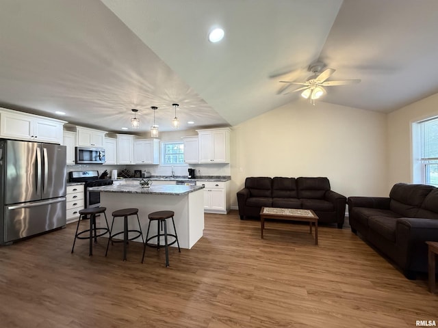 312 Mcvicker Dr, Energy, IL 62933 - kitchen featuring stainless steel appliances, open floor plan, white cabinetry, plenty of natural light, and recessed lighting