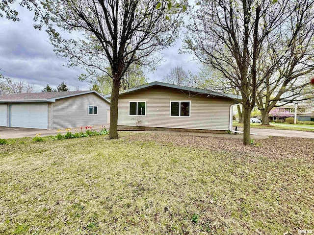 1401 12th Ave, Viola, IL 61486 - view of property exterior with a lawn, a garage, and an outdoor structure