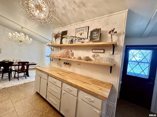 1401 12th Ave, Viola, IL 61486 - kitchen with butcher block counters, a chandelier, open shelves, and vaulted ceiling