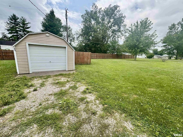 15 5th St, Matherville, IL 61263 - view of yard with an outdoor structure, driveway, and a detached garage