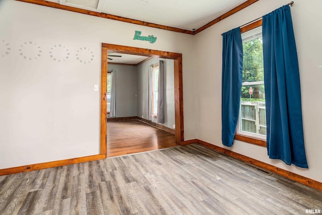 503 W Idaho Ave, Carterville, IL 62918 - empty room featuring crown molding and wood finished floors