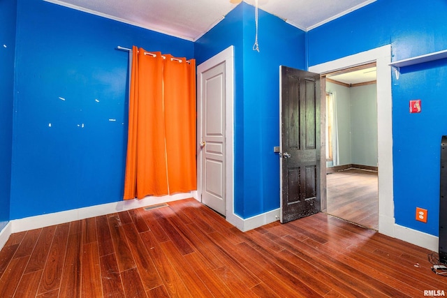 503 W Idaho Ave, Carterville, IL 62918 - empty room with wood finished floors and crown molding