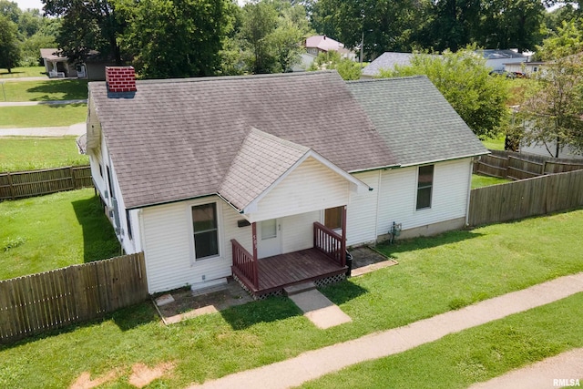 503 W Idaho Ave, Carterville, IL 62918 - view of front of house with roof with shingles, a chimney, and a fenced backyard