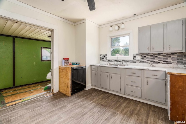 503 W Idaho Ave, Carterville, IL 62918 - kitchen featuring dishwasher, wood finished floors, backsplash, light countertops, and ornamental molding