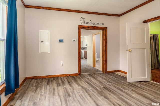 503 W Idaho Ave, Carterville, IL 62918 - empty room featuring electric panel, wood finished floors, and crown molding