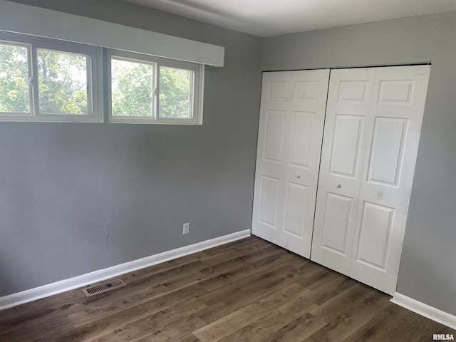 304 Lynda Dr Unit A/B, Carbondale, IL 62901 - unfurnished bedroom featuring a closet and dark wood finished floors