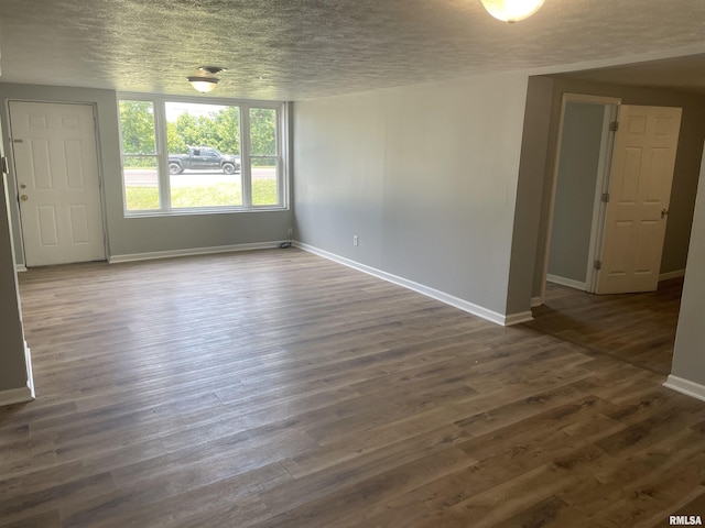 304 Lynda Dr Unit A/B, Carbondale, IL 62901 - spare room with a textured ceiling and dark wood-style floors